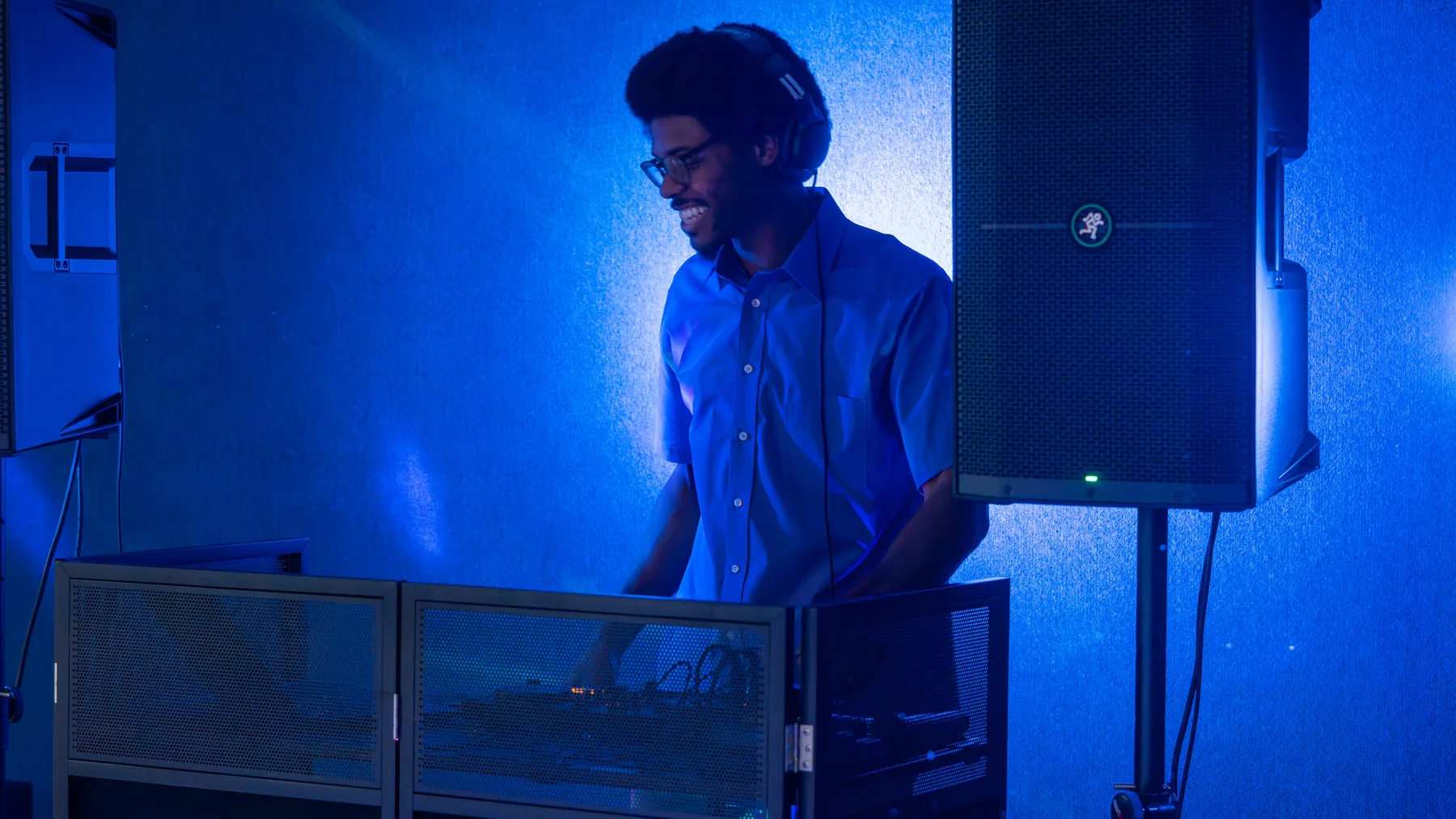 Ian Wade working behind his DJ booth