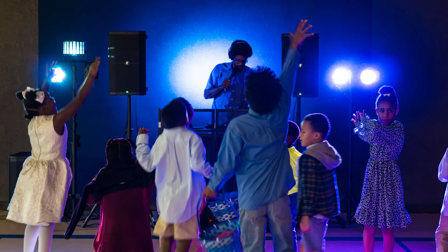Kids dancing during a Smile & Spin DJ event