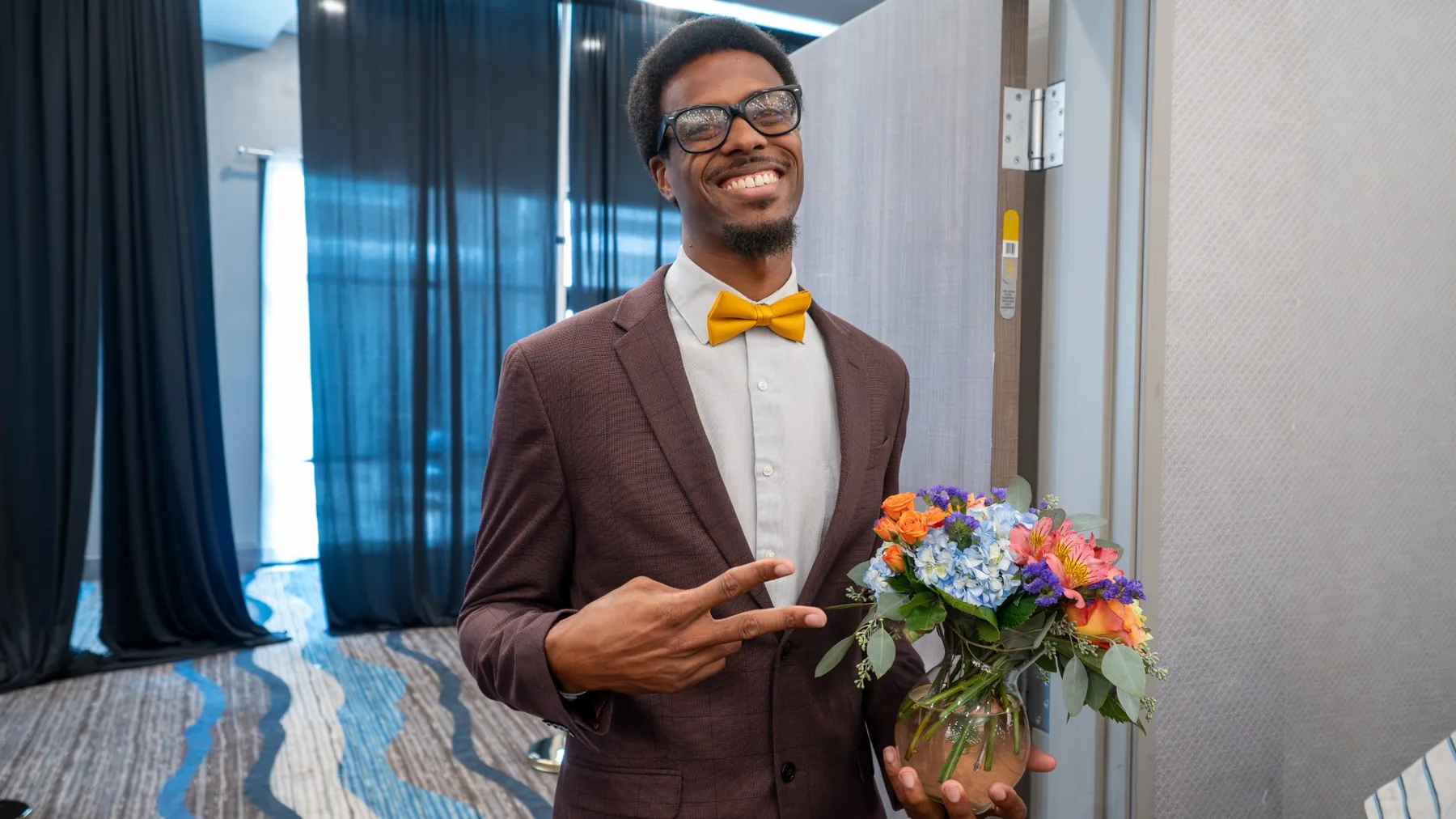 Ian Wade smiling in formal attire at a Mentoring Alliance event