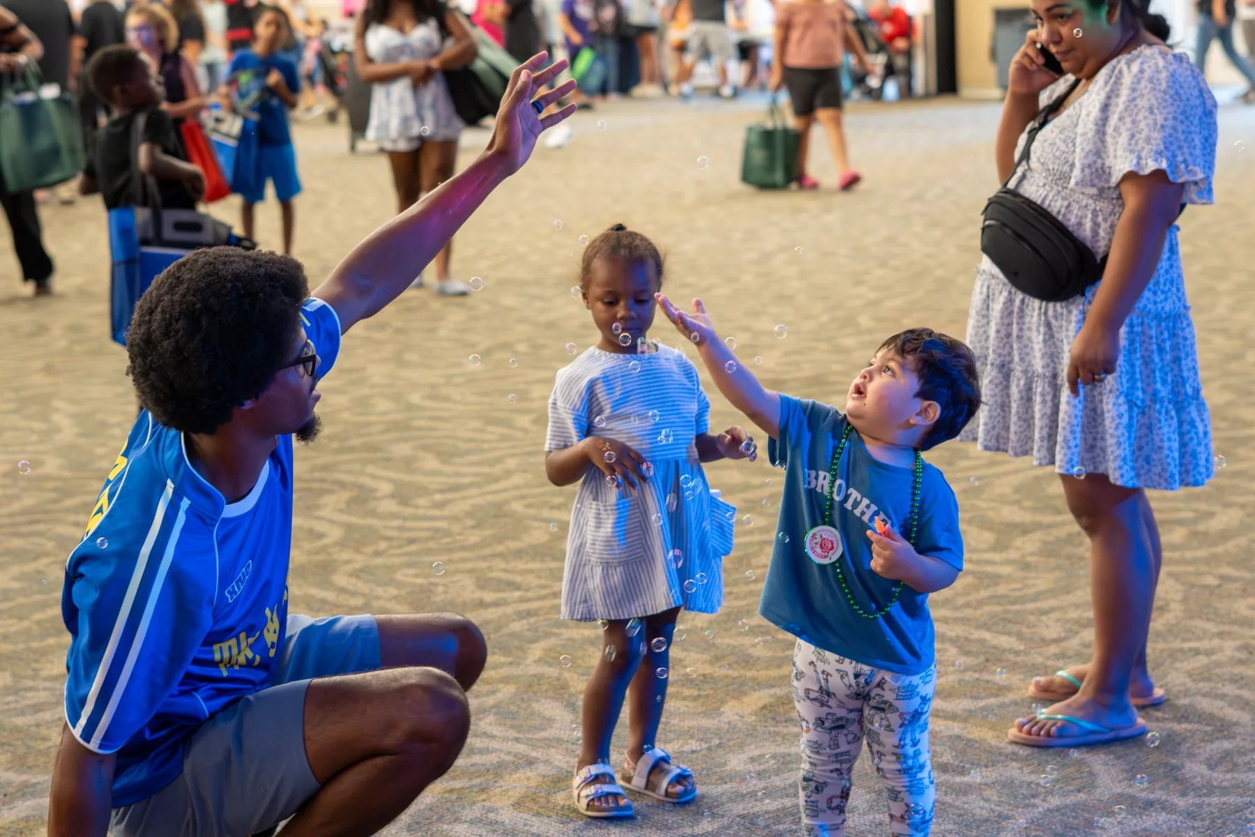 Ian Wade interacting with children during a large Green Acres Baptist Church family event