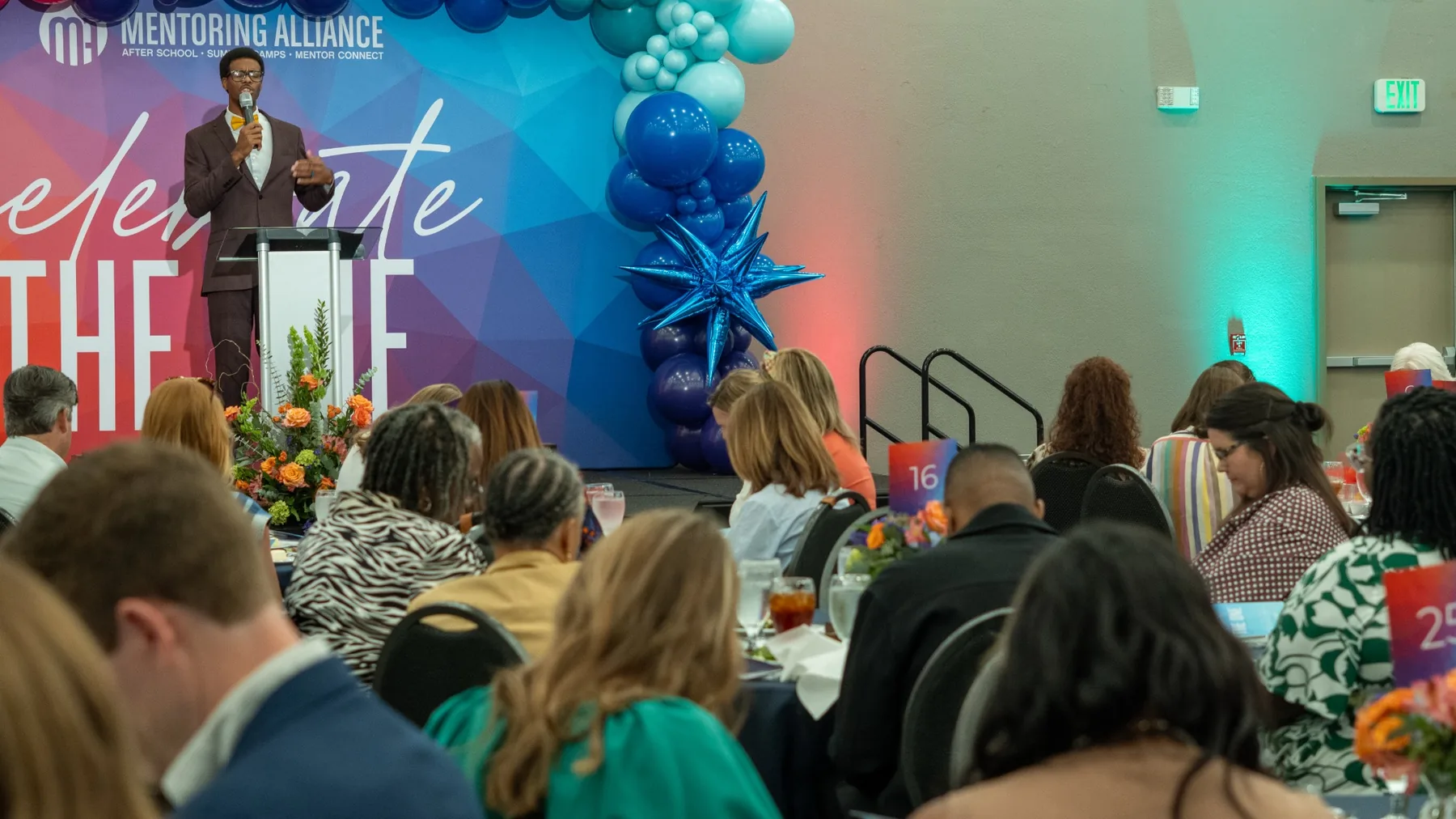 Ian Wade speaking to a large Mentoring Alliance audience